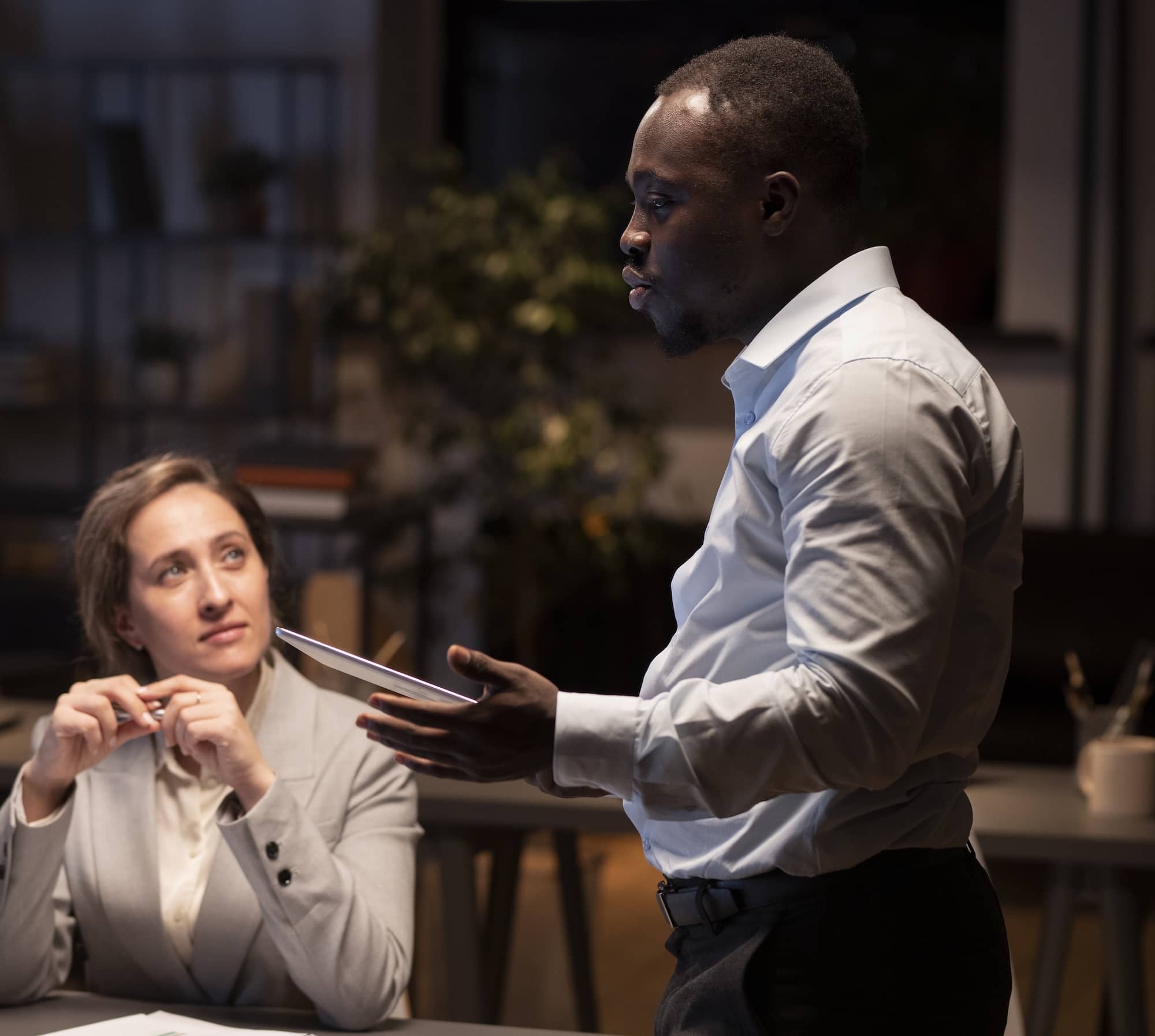 An african man speaking to a group of people