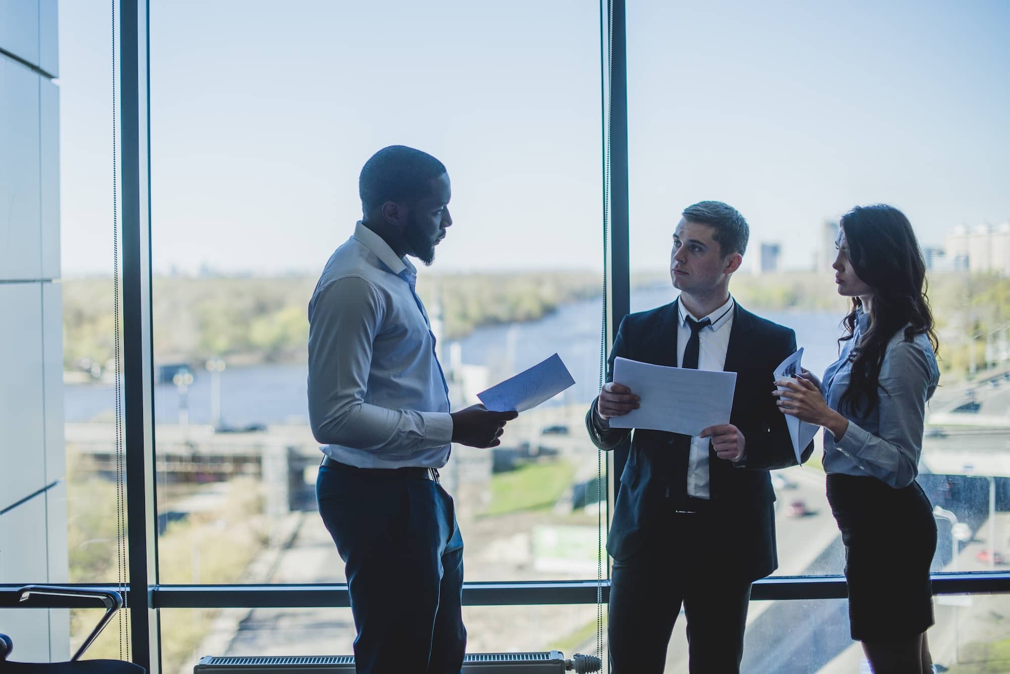 Three people in a meeting